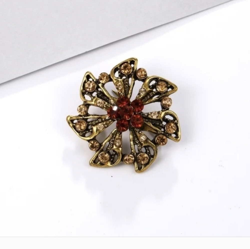 Elegant Floral Brooch with Orange & Gold Accents
